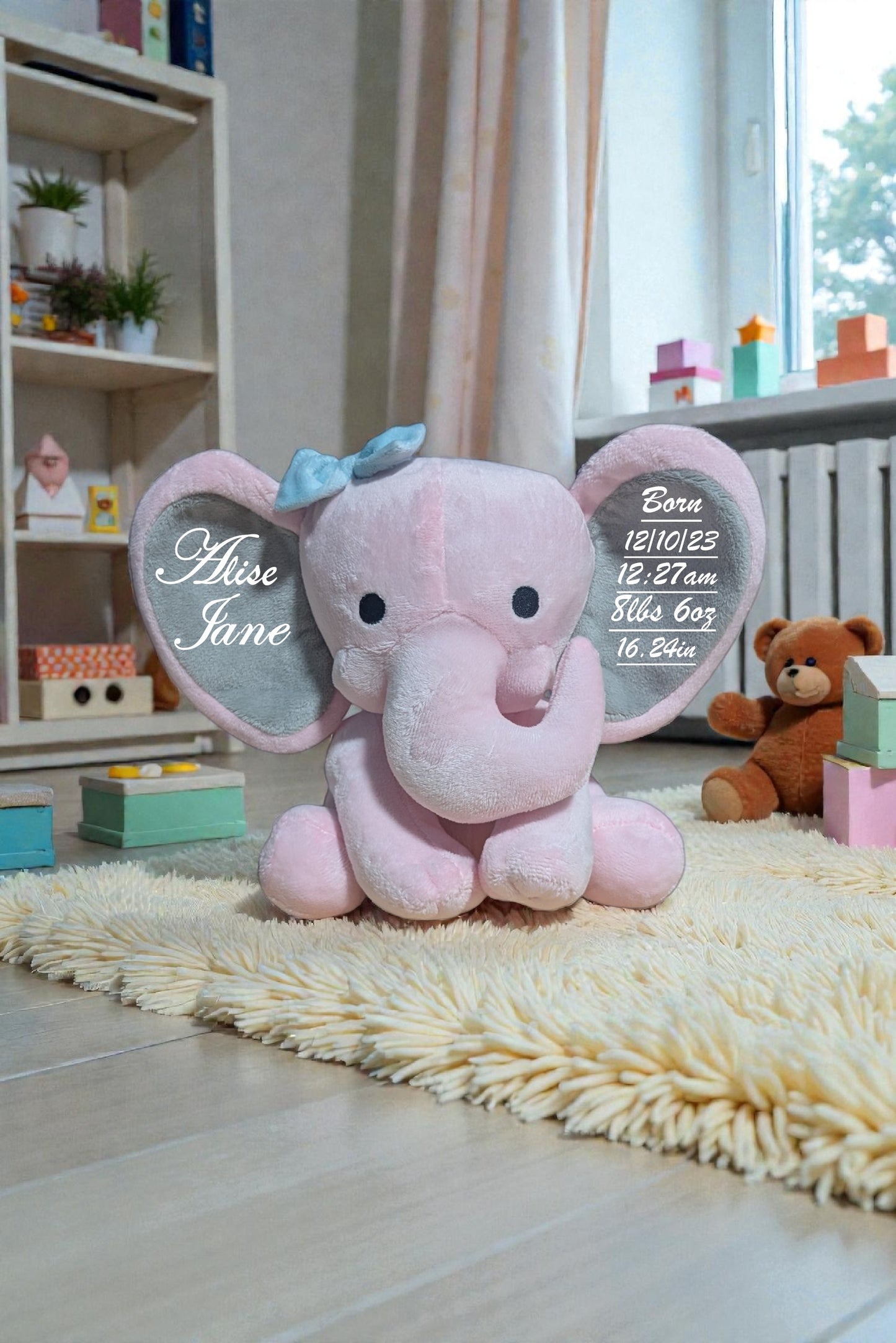 Pink elephant plush toy with engraved details on a rug in a room with toys and a shelf.