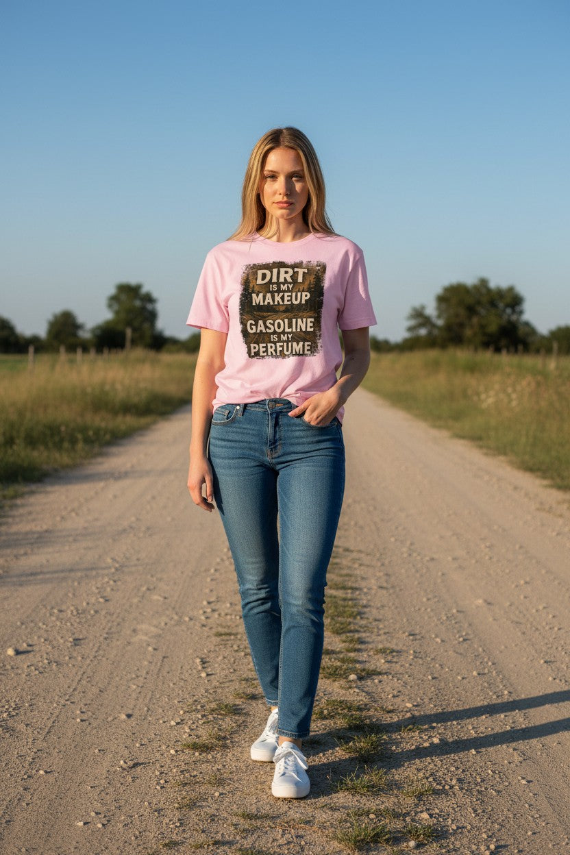 Woman wearing a pink t-shirt with text on a dirt road
