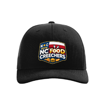 Black cap with NC Food Creechers logo on a white background