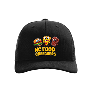 Black cap with 'NC Food Creechers' design featuring cartoon food items on a white background