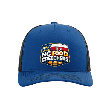 Blue cap with 'NC Food Creechers' logo on a white background